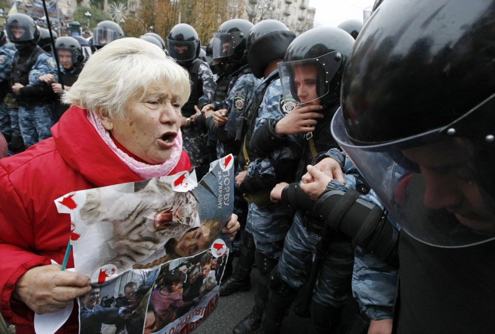 A supporter of Ukrainian former prime minister Yulia Tymoshenko shouts at riot police during a rally near the Pecherskiy district court in Kiev