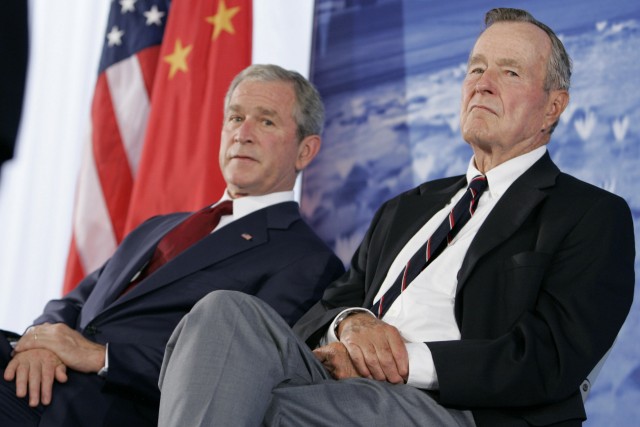 U.S. President Bush and his father attend the dedication of the new U.S. embassy in Beijing