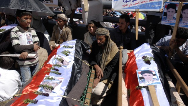 Mourners attend a rally to demand the ouster of Yemen's President Ali Abdullah Saleh in Sanaa