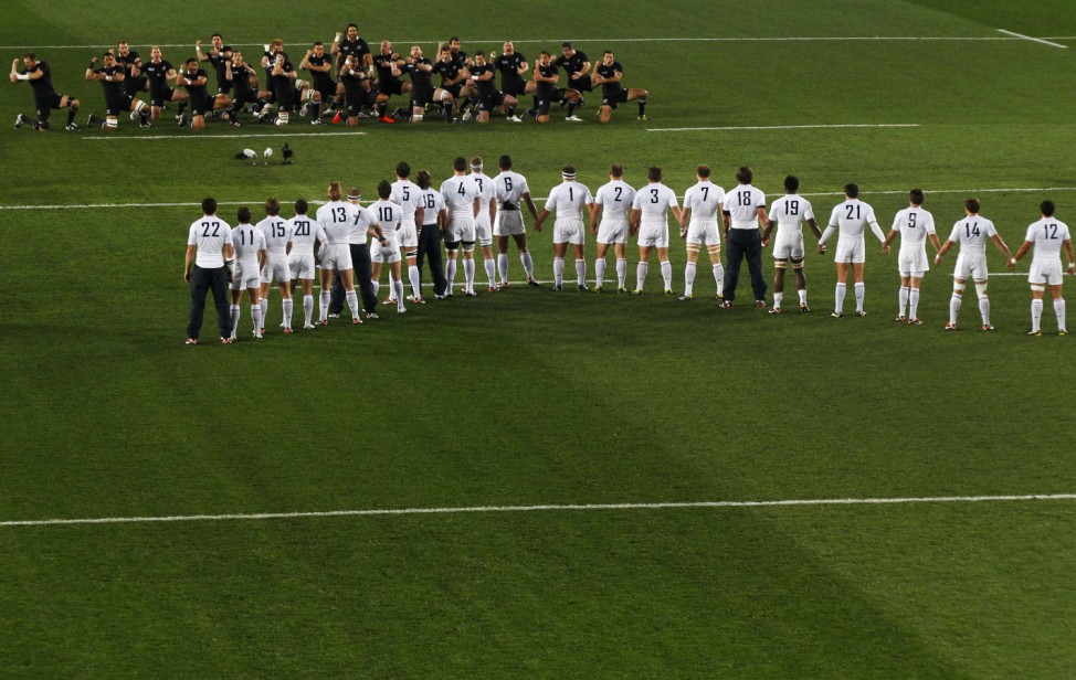 New Zealand All Blacks' players perform the Haka as France players look on before their Rugby World Cup final match in Auckland