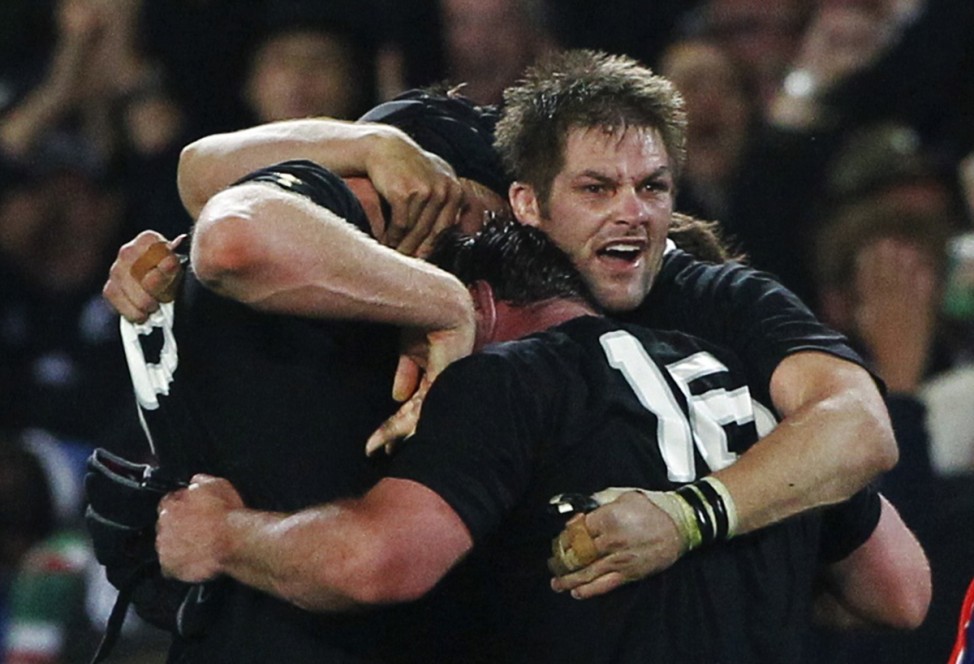 New Zealand All Blacks' players celebrate after beating France to win the Rugby World Cup final in Auckland