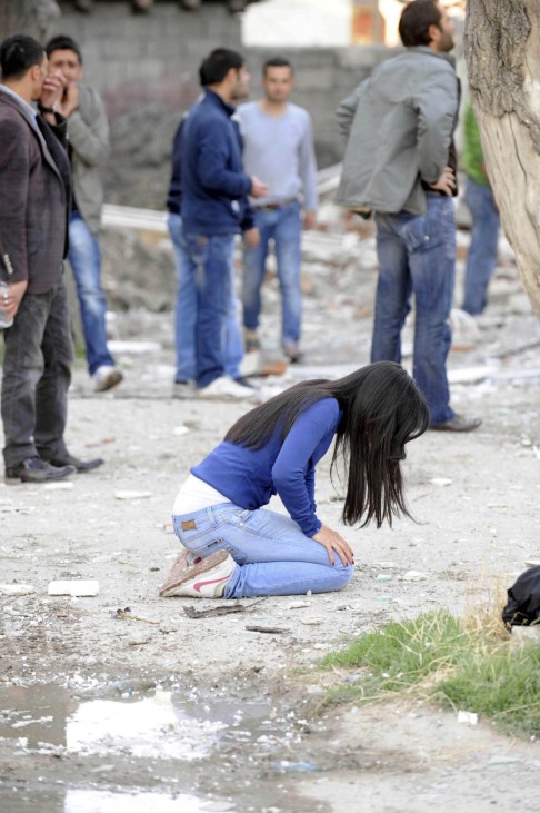 Survivors react following an earthquake in Tabanli village near the eastern Turkish city of Van