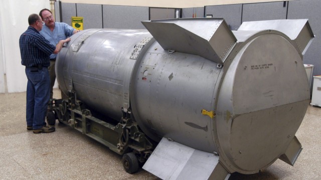 Workers examine a B53 nuclear bomb at B&W Pantex nuclear weapons storage facility outside Amarillo in handout photograph