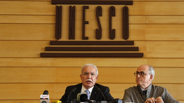 Palestinian Foreign Minister al-Malki and Palestinian ambassador to UNESCO Sanbar attend a press conference during the 36th session of UNESCO's General Conference in Paris