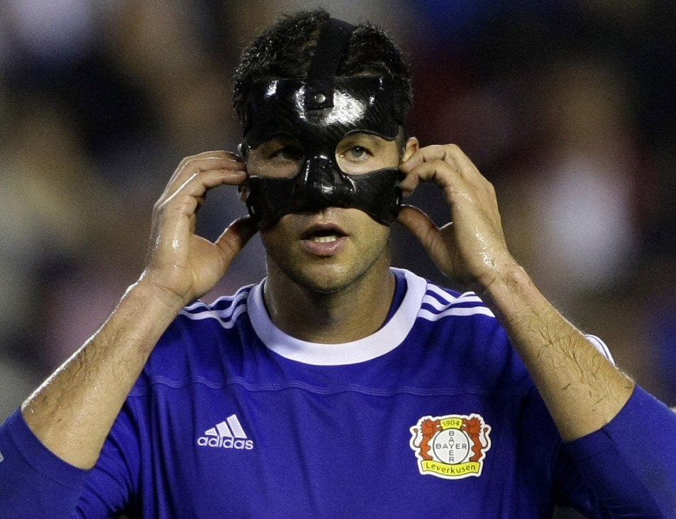 Bayer Leverkusen's Michael Ballack adjusts his mask during their Champions League Group E soccer match against Valencia at Mestalla stadium in Valencia