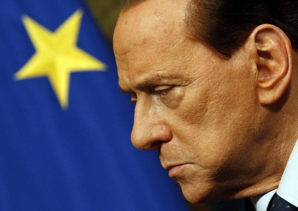 File photo of Italian PM Berlusconi attending a meeting with European Commission President Barroso in Rome