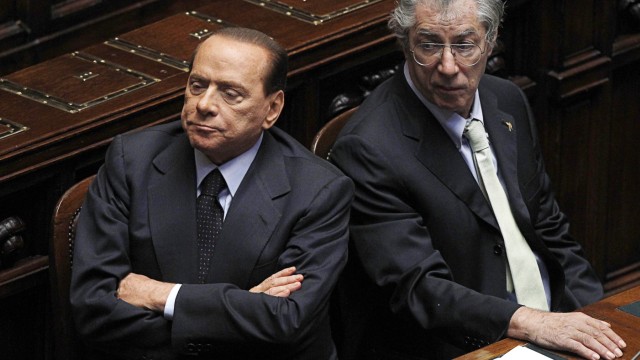 Italy's PM Berlusconi and Minister of Federal Reforms Bossi attend a session at the Parliament in Rome
