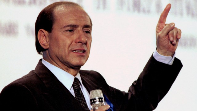 File photo of Berlusconi, leader of Italy's right-wing Forza Italia (Go Italy) party, speaking at a rally to close his party's campaign