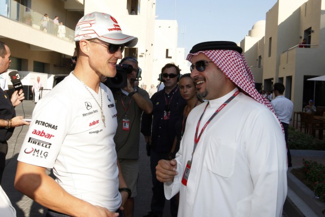 Mercedes Formula One driver Schumacher speaks to the Bahrain's Crown Prince Salman bin Hamad al-Khalifa before the Abu Dhabi F1 Grand Prix at Yas Marina circuit in Abu Dhabi