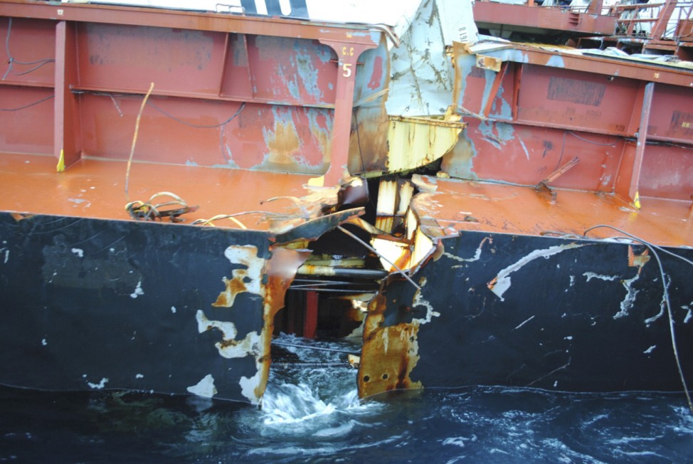 Seawater washes in and out of the fracture on the starboard side of the 47,230 tonne Liberian-flagged Rena, about 12 nautical miles (22 km) from Tauranga, on the east coast of New Zealand's North Island