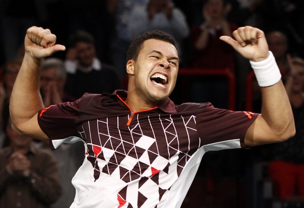 Jo-Wilfried Tsonga of France reacts after he won his semi-final match against John Isner of the U.S. in the Paris Masters tennis tournament