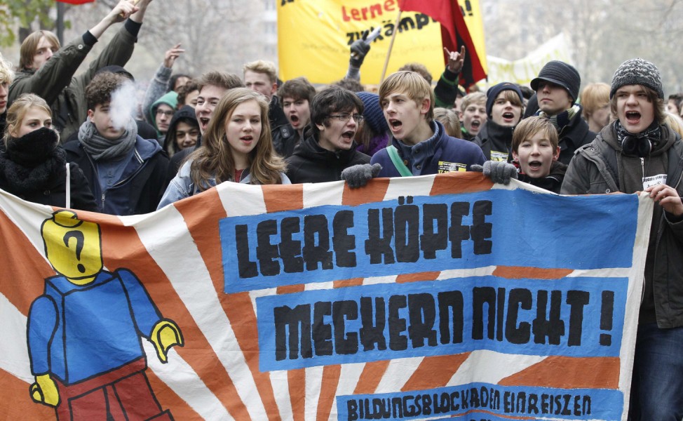 German pupils carry banner during demonstration in Berlin