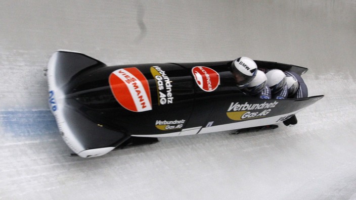 Germany's Adjei, Machata, Bredau and Becke speed down the track on their way to win the four-man bobsleigh competition in Winterberg