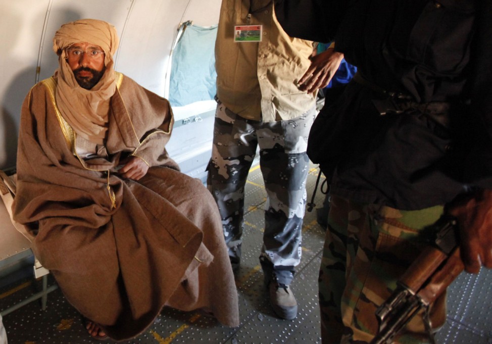 Saif al-Islam Gaddafi is pictured sitting in a plane in Zintan