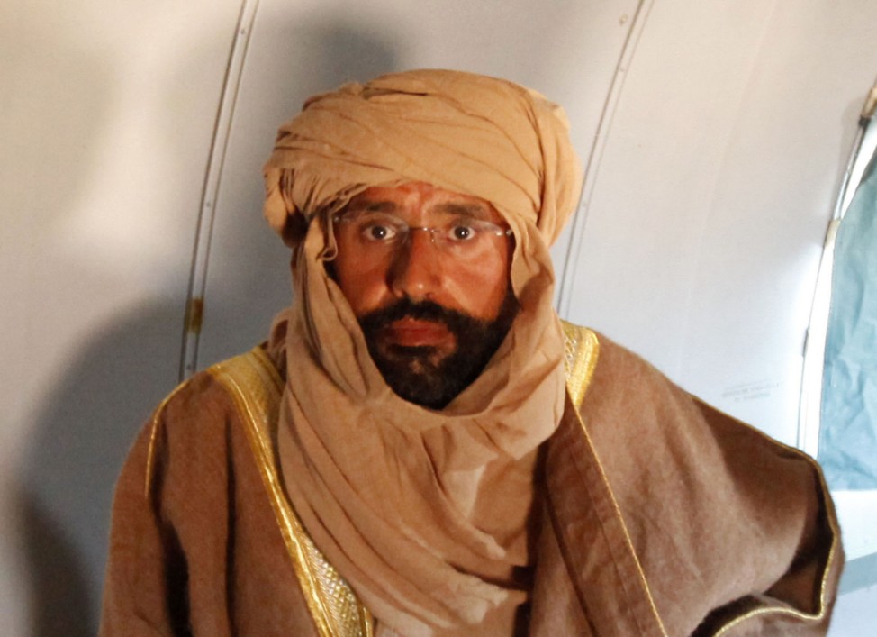 Saif al-Islam Gaddafi is seen sitting in a plane in Zintan