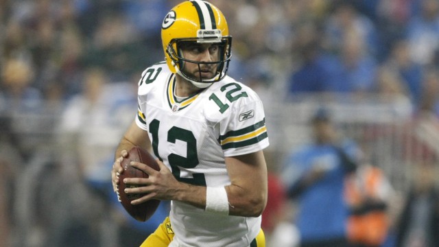 Green Bay Packers quarterback Aaron Rodgers  looks for his receiver during the second half of their NFL football game against the Detroit Lions in Detroit,