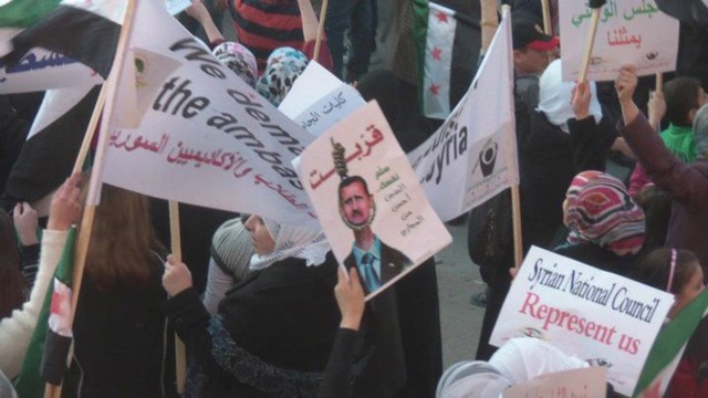 Demonstrators protest against Syria's President Bashar al-Assad in Hula