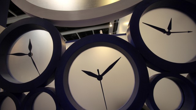 Clocks are seen at a booth at the Hong Kong Watch and Clock Fair 2010 in Hong Kong