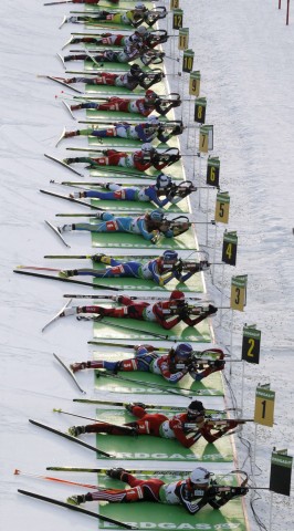 Competitors shoot during the mixed 2 x 6 + 2 x 7.5 km relay at the IBU Biathlon World Championships in Khanty-Mansiysk