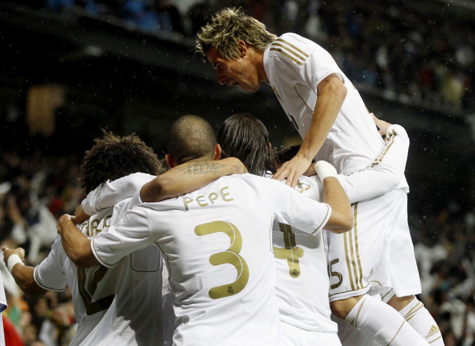 Real Madrid players celebrate a goal against Barcelona during their Spanish first division soccer match in Madrid