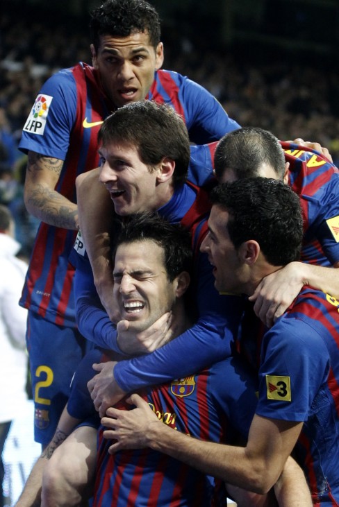 Barcelona's Fabregas celebrates his goal against Real Madrid with his teammates during their Spanish first division soccer match, the 'Clasico', in Madrid