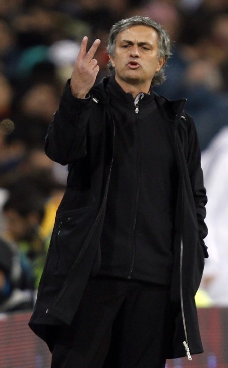 Real Madrid's coach Jose Mourinho gestures to his players after Xavi Hernandez's goal during their Spanish first division soccer match, the 'Clasico',  at the Santiago Bernabeu stadium in Madrid