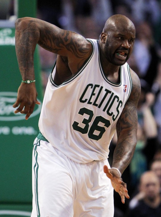 Boston Celtics center Shaquille O'Neal reacts after making a basket and drawing a foul against the Detroit Pistons in the second half of their NBA basketball game in Boston