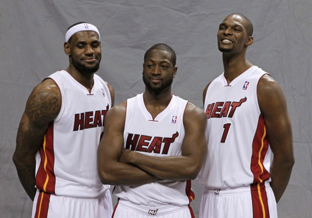 Miami Heat's LeBron James, Dwyane Wade and Chris Bosh pose during media day at the team's training camp in Miami