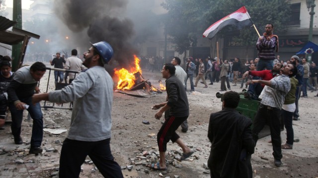 Protesters clash with the Egyptian army in the Prime Ministry str