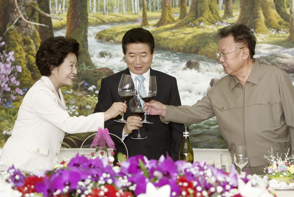 File photo of North Korean leader Kim, South Korean President Roh and Roh's wife Yang-sook toasting during a luncheon in Pyongyang