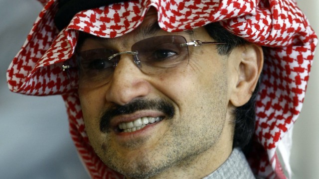 Saudi billionaire Prince Alwaleed bin Talal reacts during a news conference in Riyadh