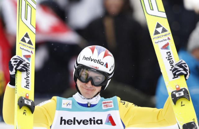 Ammann of Switzerland reacts after taking ninth place in the individual large hill ski jumping World Cup in Engelberg