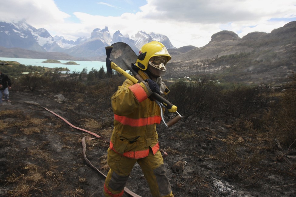 A firefighter walks to tackle a wildfire at the Chilean Torres del Paine national park in the southern Patagonia region of Chile