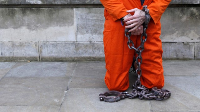 A demonstrator dressed as a prisoner protests against the U.S. prison at Guantanamo Bay outside the Ministry of Defence in London
