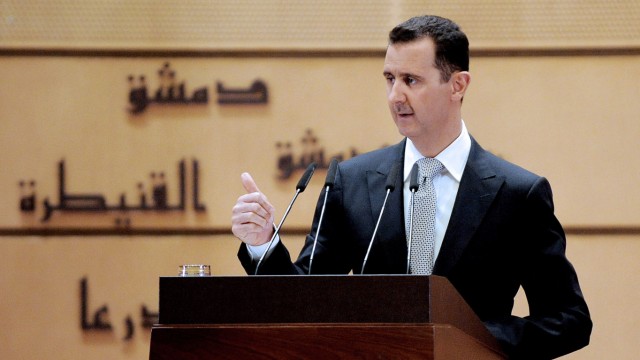 Syrian President Bashar al-Assad deliver  a speech