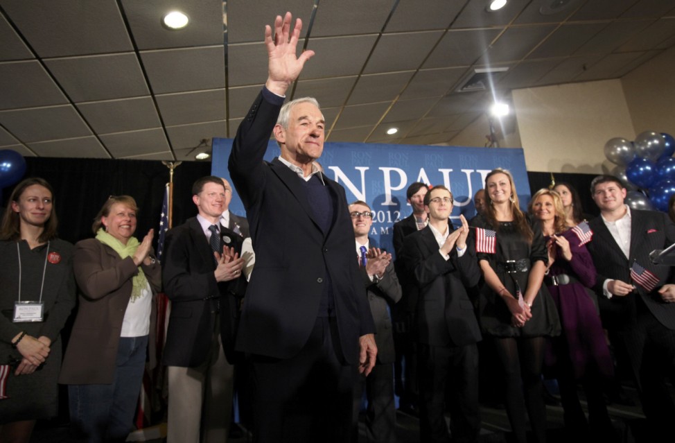 Republican presidential candidate and Congressman Ron Paul waves to supporters after speaking at his New Hampshire primary night rally in Manchester