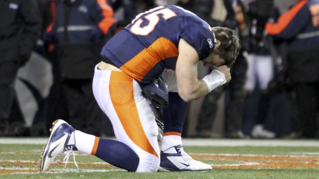 Denver Broncos quarterback Tim Tebow prays after the Broncos defeated the Pittsburgh Steelers in overtime in the NFL AFC wildcard playoff football game in Denver