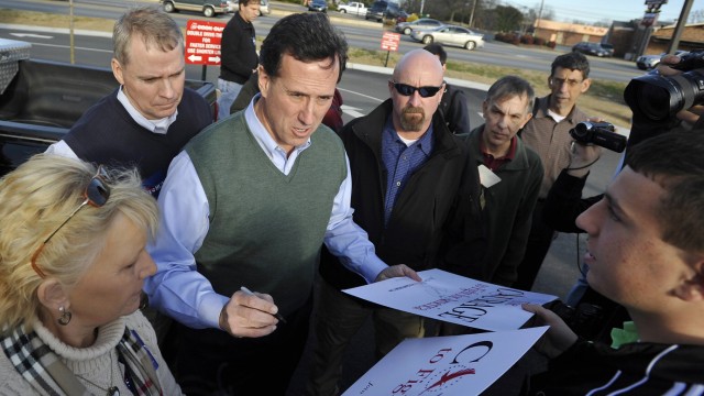 Republican presidential candidate Santorum greets supporters during a campaign stop in Gaffney