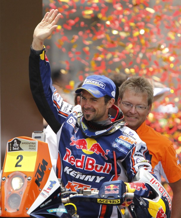 KTM's Cyril Despres of France celebrates with his team on the podium after winning the fourth South American edition of the Dakar Rally 2012, in Lima