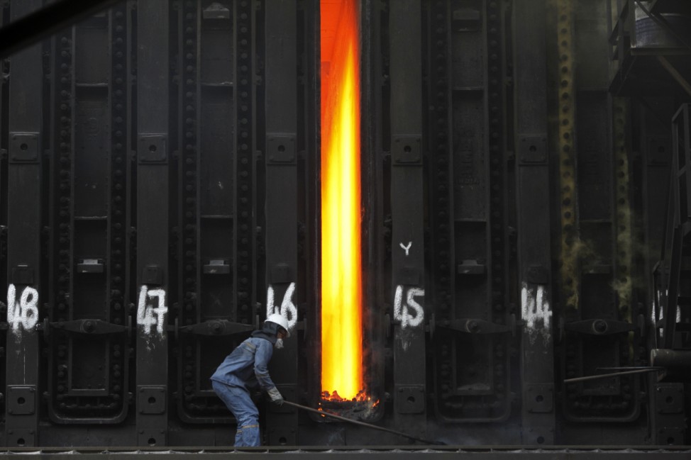A man works at Turkish steel manufacturer ISDEMIR in Iskenderun in Hatay province