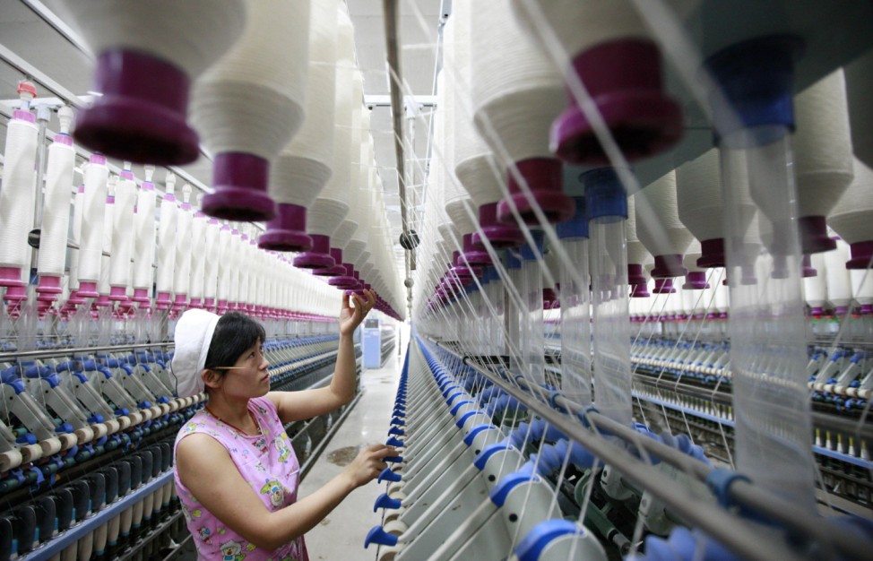 A labourer works at a textile mill in Huaibei