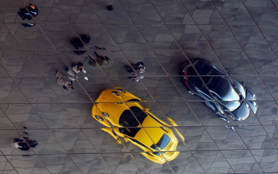 The new Porsche 911 sports car is reflected in a roof at the Porsche factory in Stuttgart