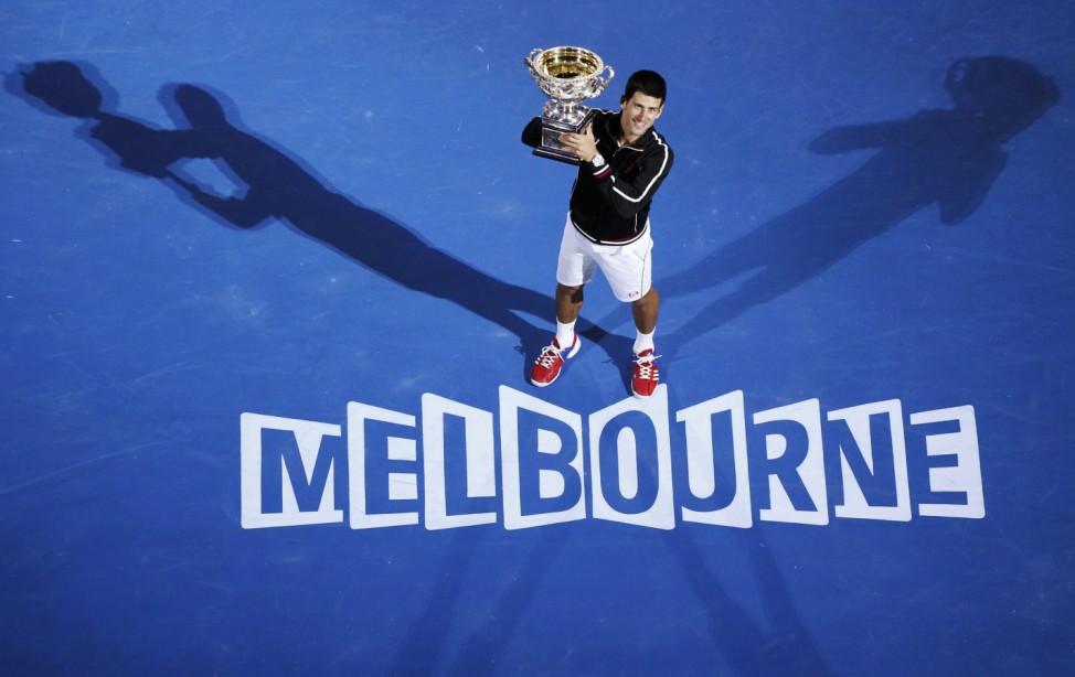 Djokovic of Serbia poses with his trophy after defeating Nadal of Spain in their men's singles final match at the Australian Open in Melbourne