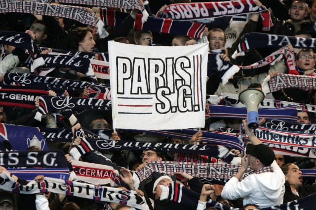 Supporters wave banners as PSG as they host Greek side Panathinaikos in a Group G UEFA soccer match at Parc des Princes stadium in Paris