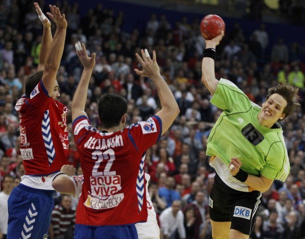 Christophersen of Germany shoots to score a goal against Serbia in the last seconds of their Men's European Handball Championship main round match in Belgrade