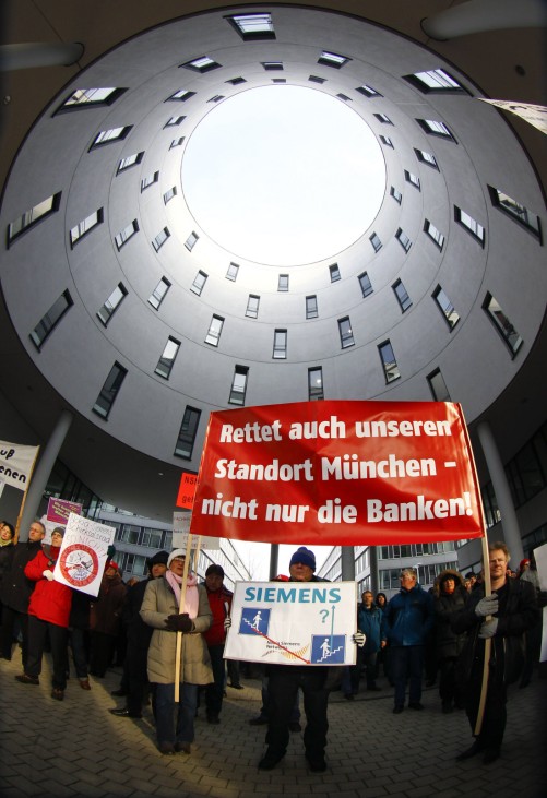 Employees of Nokia Siemens Networks demonstrate in front of the German headquarters of NSN against job cuts in Munich