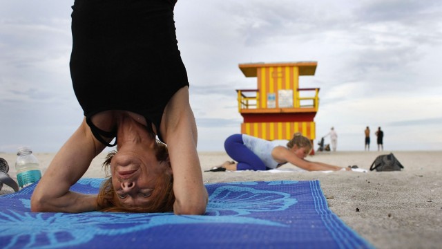 FLORIDIANS RELIEVE STRESS WITH YOGA ON THE BEACH