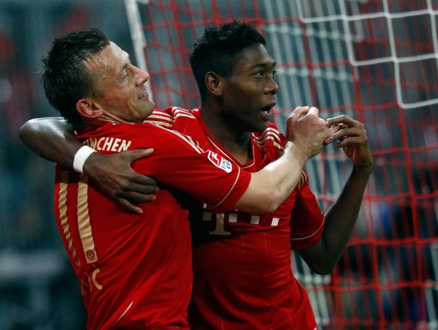 Munich's Olic and Alaba celebrate during their German Bundesliga first division soccer match against Wolfsburg in Munich