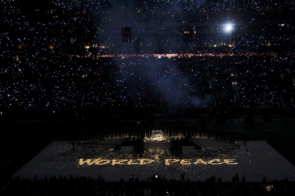 'World Peace' is spelled out with lights as Madonna performs during the halftime show in the NFL Super Bowl XLVI football game in Indianapolis
