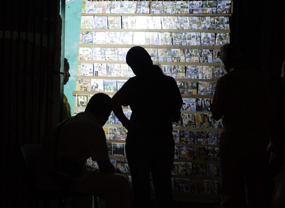People look at DVDs at a privately licensed stall in Havana